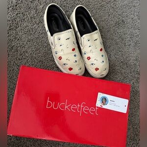 Bucket Feet Cream Graphic Slip-On Shoes